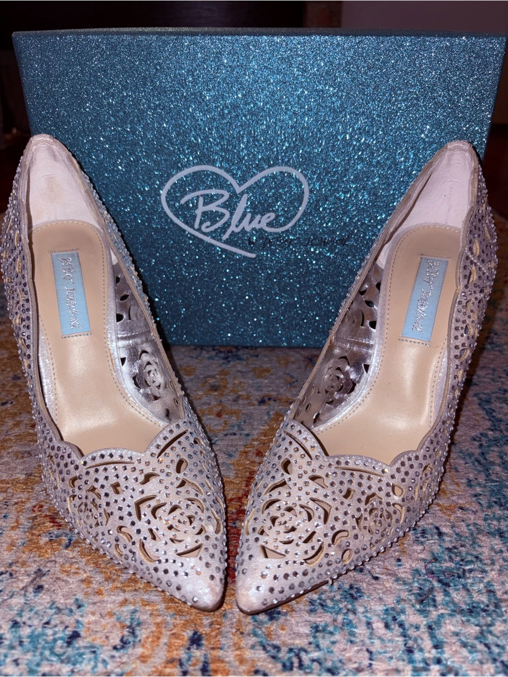 Betsey Johnson Ivory Laser-Cut Pointed Toe Pumps with Crystal Accents.